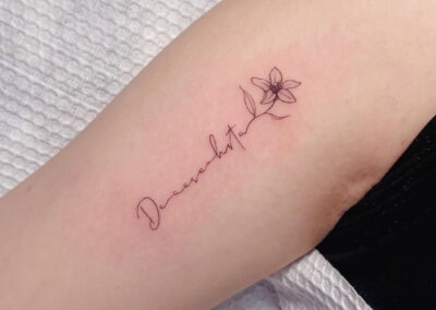Delicate Script with Flower Tattoo